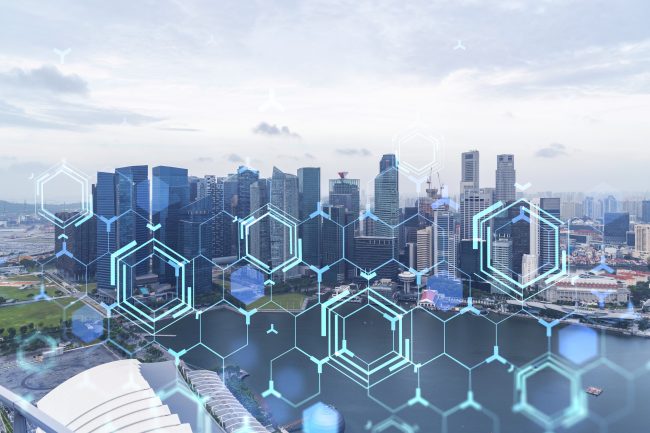 Technology hologram over panorama city view of Singapore. The largest tech hub in Asia. The concept of developing coding and high-tech science. Double exposure. Technology hologram over panorama city view of Singapore