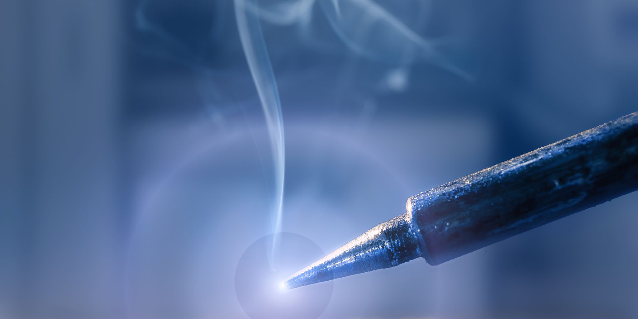 Soldering, shallow DOF, focus on the tip, text space